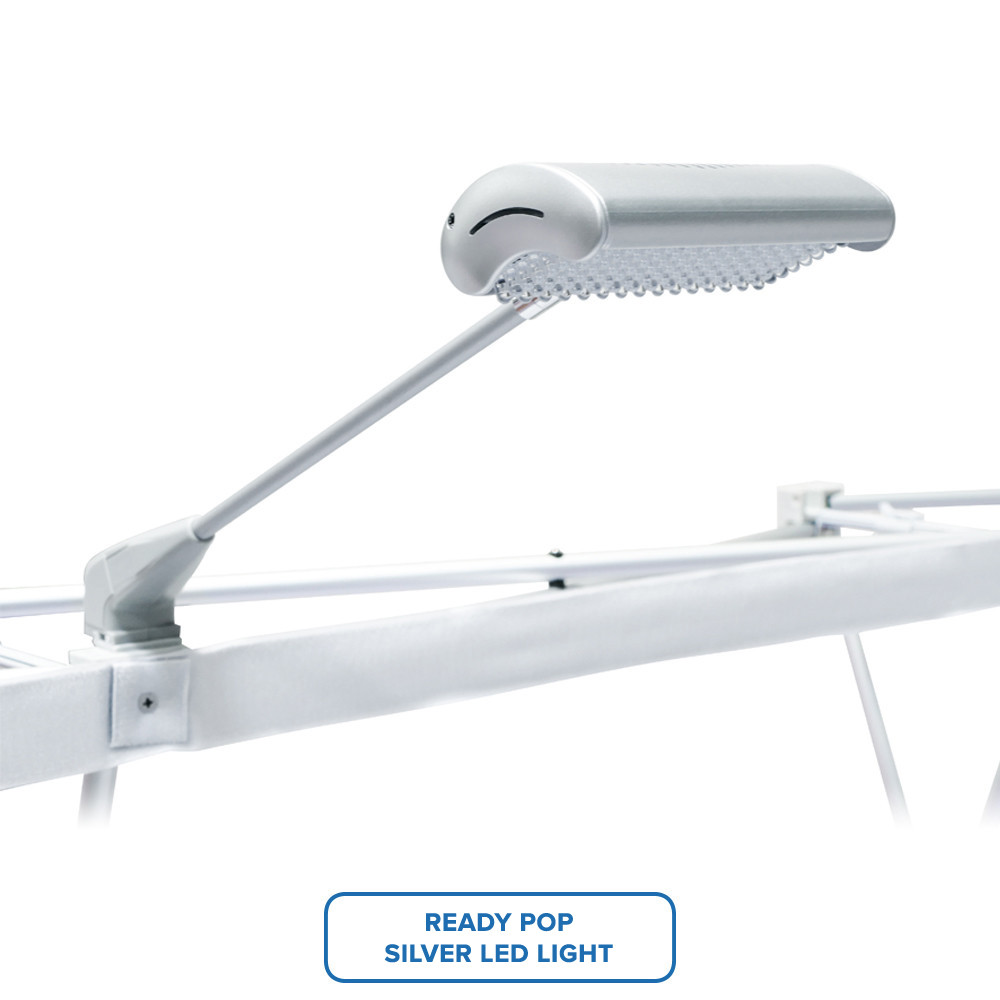 Silver LED light mounted on a white pop-up display frame.