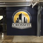 Custom gym wall decals for branding and motivational messaging