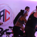 Branded wall decal enhancing atmosphere in indoor fitness class