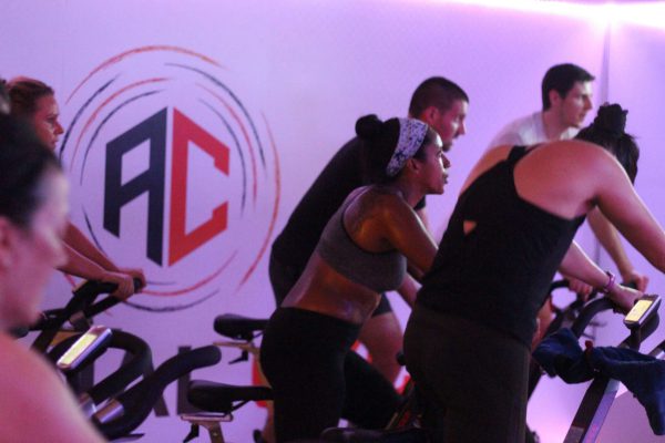 Branded wall decal enhancing atmosphere in indoor fitness class