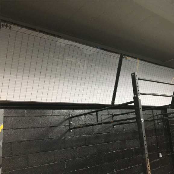 Custom dry erase board for CrossFit gym programming and notes
