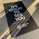 Rectangular vinyl floor decal greeting guests with “It’s Great to See You” message.