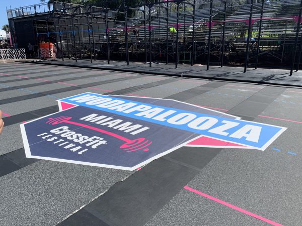 Wodapalooza CrossFit Festival floor decal at outdoor competition arena in Miami.