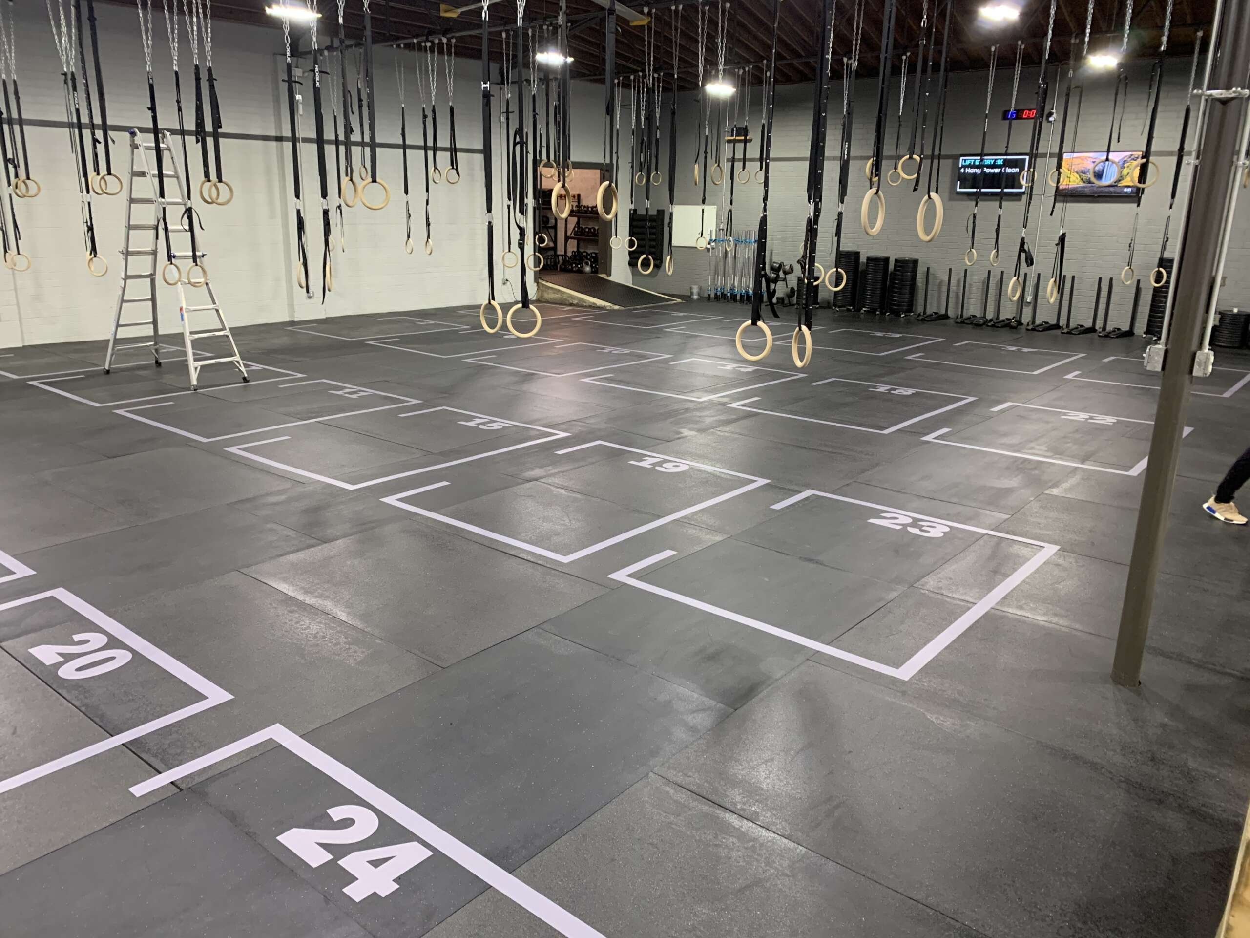Textured gym floor decals for safe and organized workouts