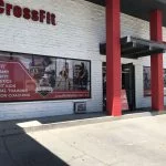 Custom window decal showing gym logo, visible from outside only.