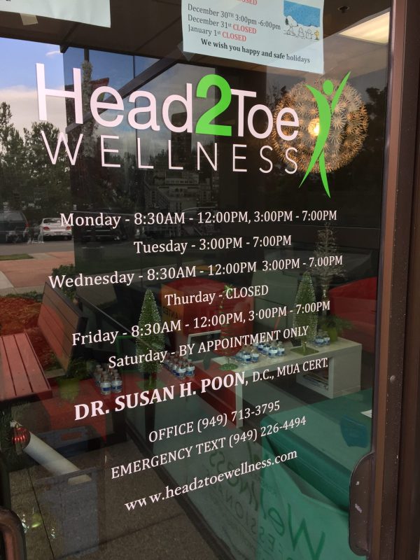Custom vinyl window decal with business hours and logo for wellness clinic