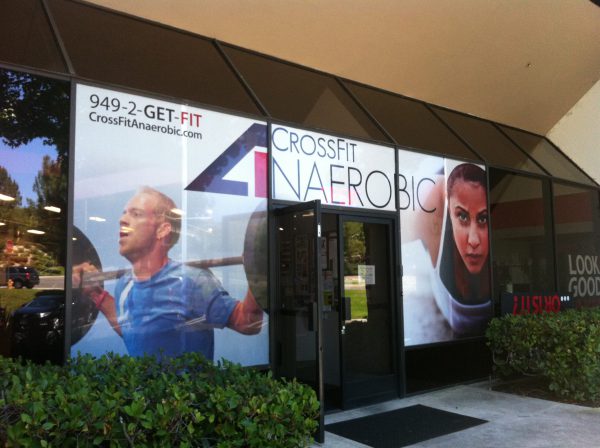 CrossFit Anaerobic gym exterior with large branded window graphics.