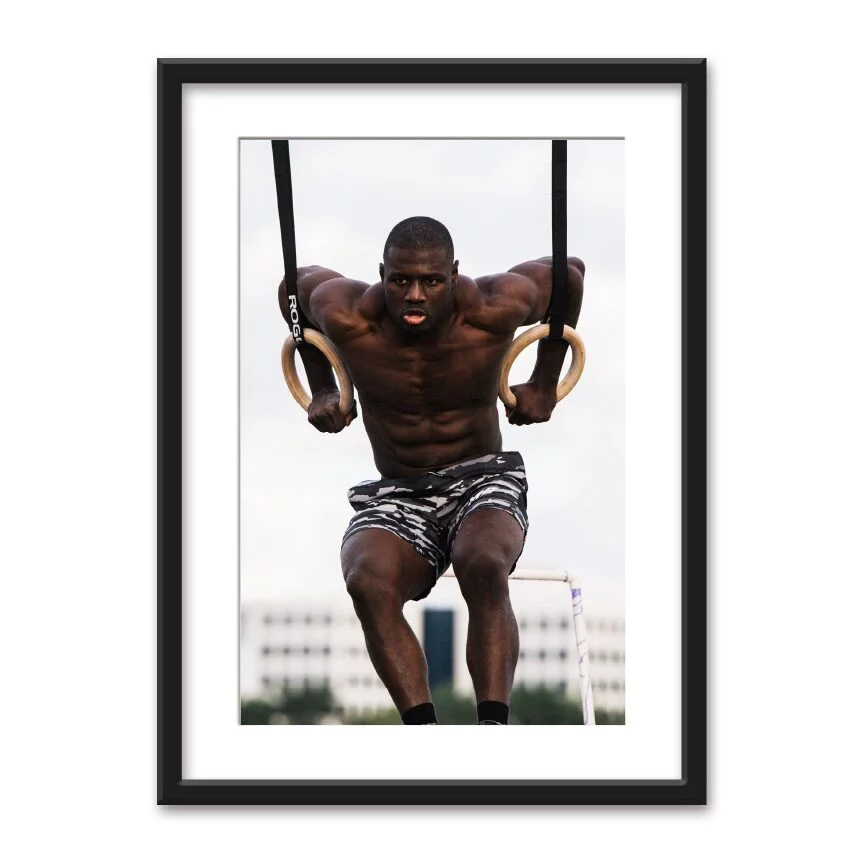 A framed poster featuring a high-resolution digitally printed graphic, encased in a matte black frame with mat board, plexiglass glazing, and masonite backing.