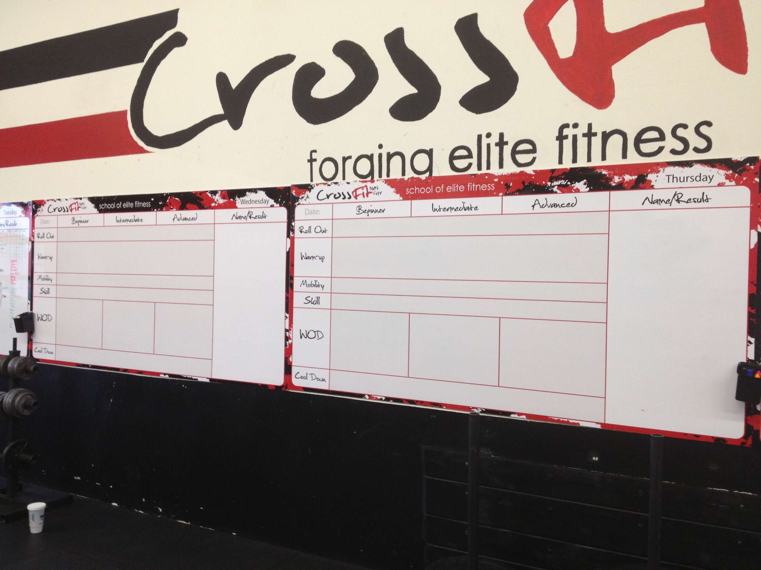 Gym whiteboard for tracking WODs, member scores, and schedules