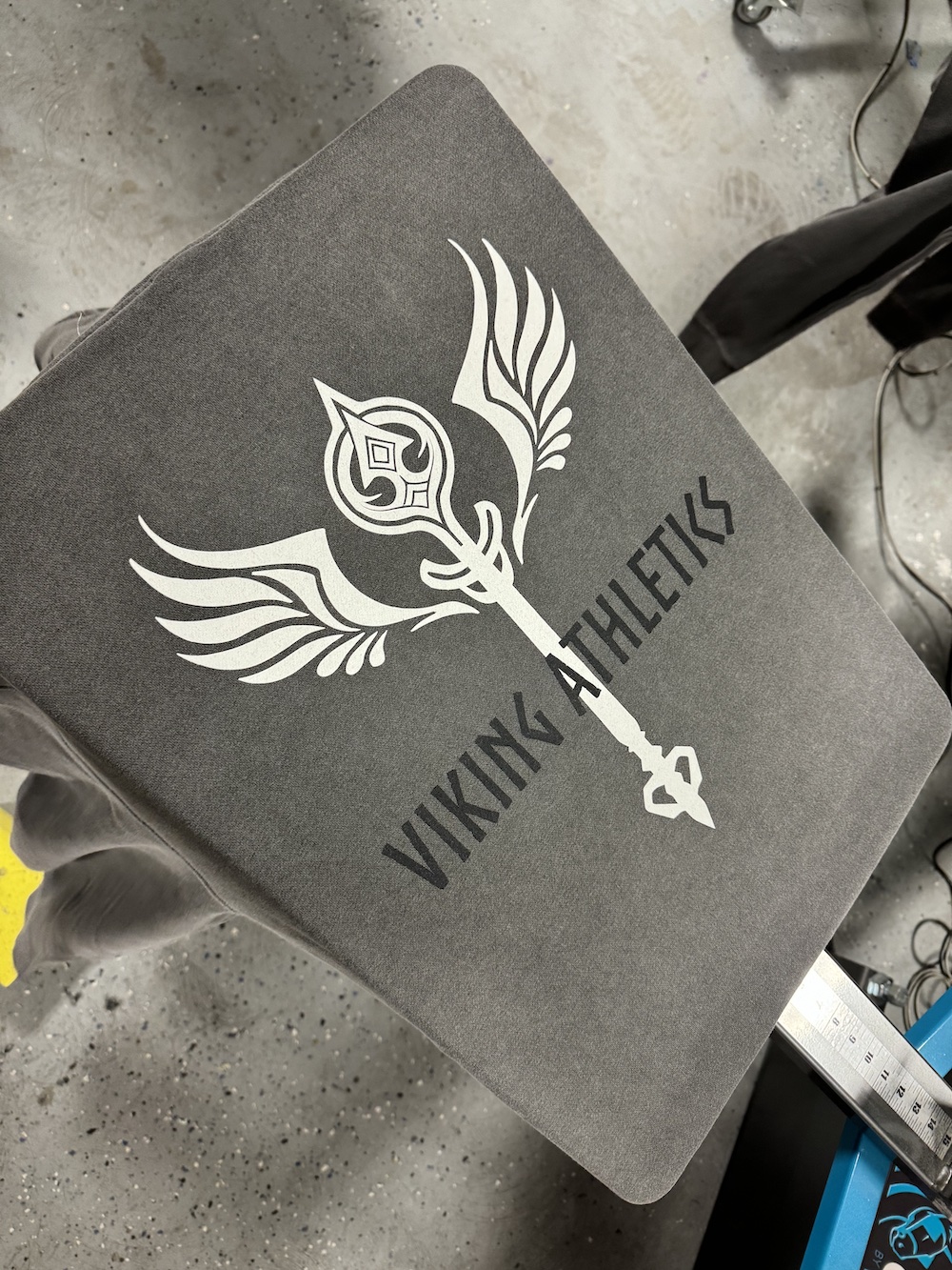 Custom athletic apparel showcasing Viking-inspired logo design