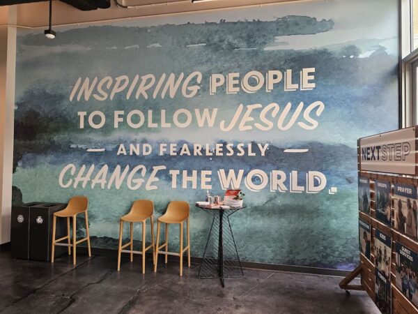 Custom-designed wall mural showcasing the business’s branding and mission, adding a personalized and visually impactful element to the space.