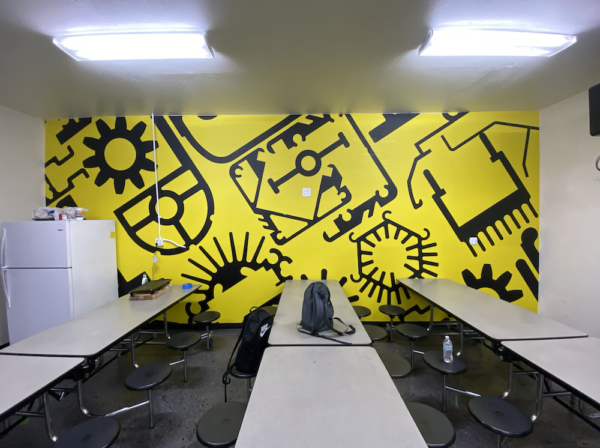 A wall mural featuring bright colors and bold designs, adding visual interest to the wall.