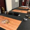 Rotated view of custom signage display at a gym competition event