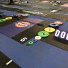 Gym interior with wall graphics and athlete nameplates during a live event