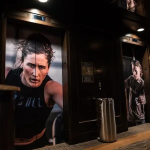 Custom wall murals for gyms, offices, or retail, with vibrant colors and branded designs.
